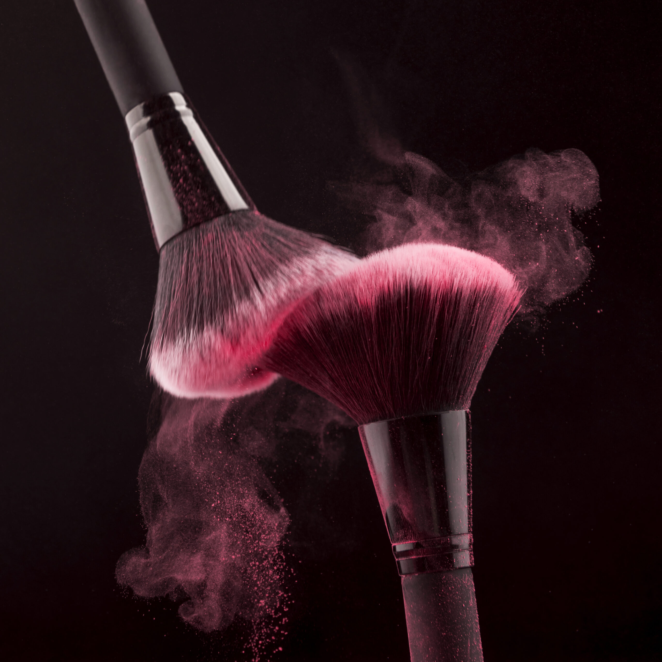 makeup-brushes-with-whirling-pink-powder